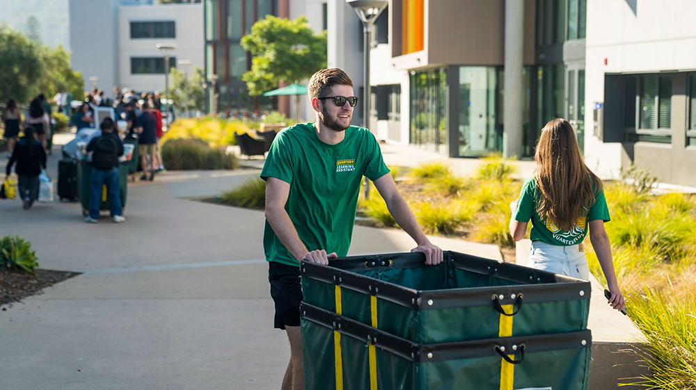 Student moving into a dorm